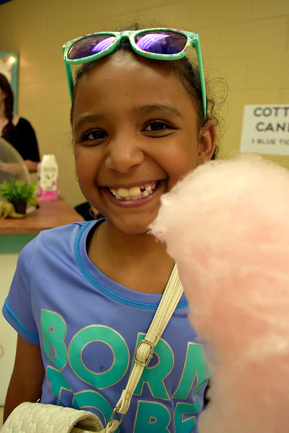 Girl Eating Cotton Candy at Member Celebration 2019