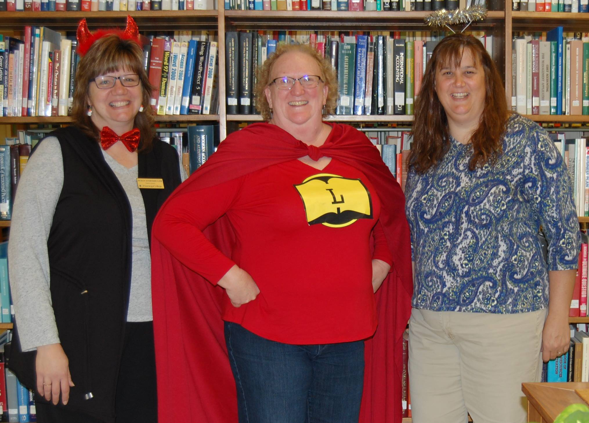 Hastings College Perkins Library staff members, Susan Steinkrueger, Pam Bohmfalk, and Alanna Armstrong. Halloween, 2017.