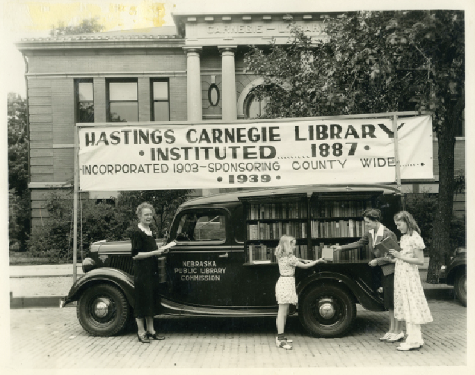 Ellen Smith with Nebraska Library Commission’s bookmobile at Hastings Jubileeum Parade, 1939. Courtesy of Adams County Historical Society.