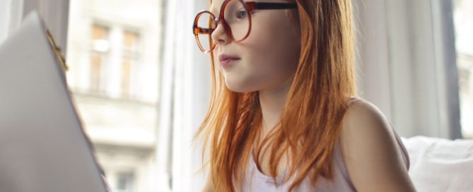 Girl with Glasses on Computer