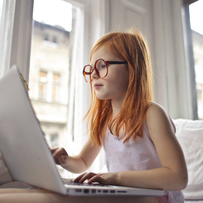 Girl with Glasses on Computer