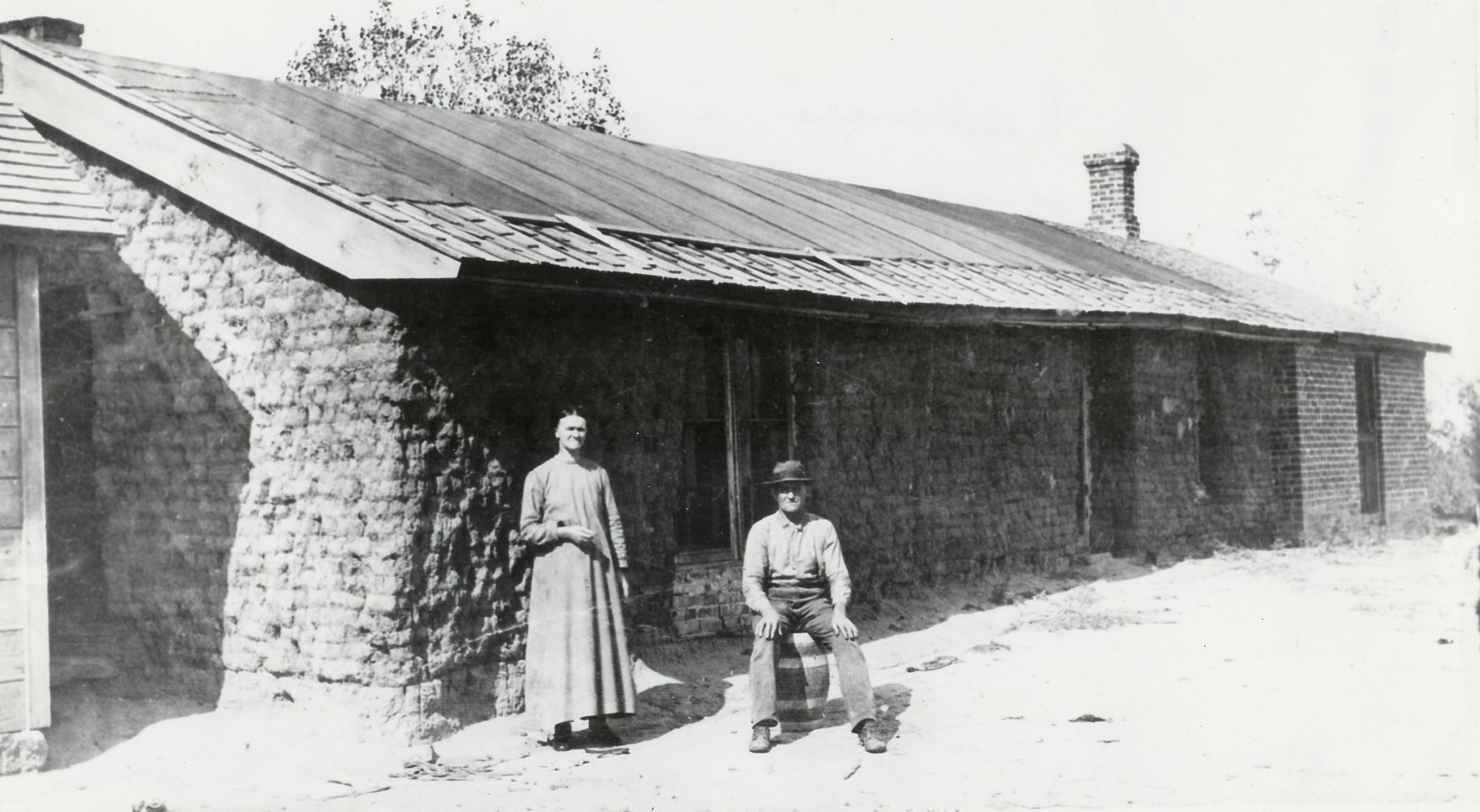 Couple in Front of Sod House