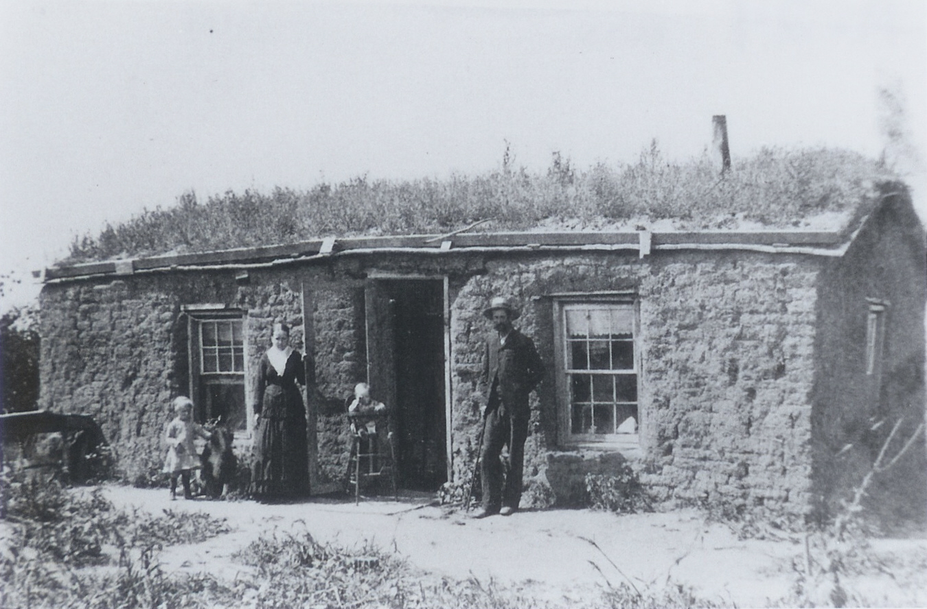 Family outside sod house, 1885. Courtesy of Adams County Historical Society.