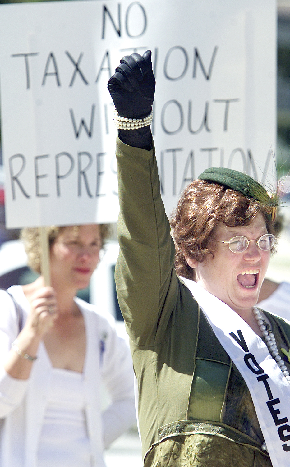 Maurine Roller hollers her support during a historical rally in honor of Women’s Equality Day, August 26, 2004. Courtesy of Hastings Tribune.