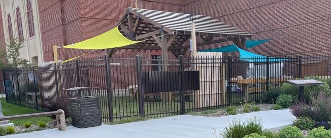 Photo of 0utdoor classroom with sails for shade and fencing
