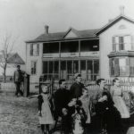 McCue Family in front of their Home
